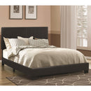  Coaster Furniture Dorian 300761KE Faux Leather Upholstered Eastern King Panel Bed - Black IMAGE 1